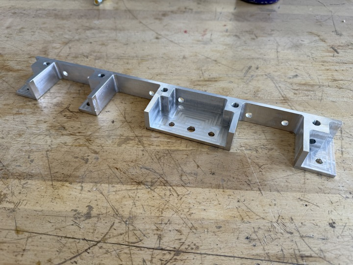 Gusset block milled in-house to reinforce the accumulator mounting interface
